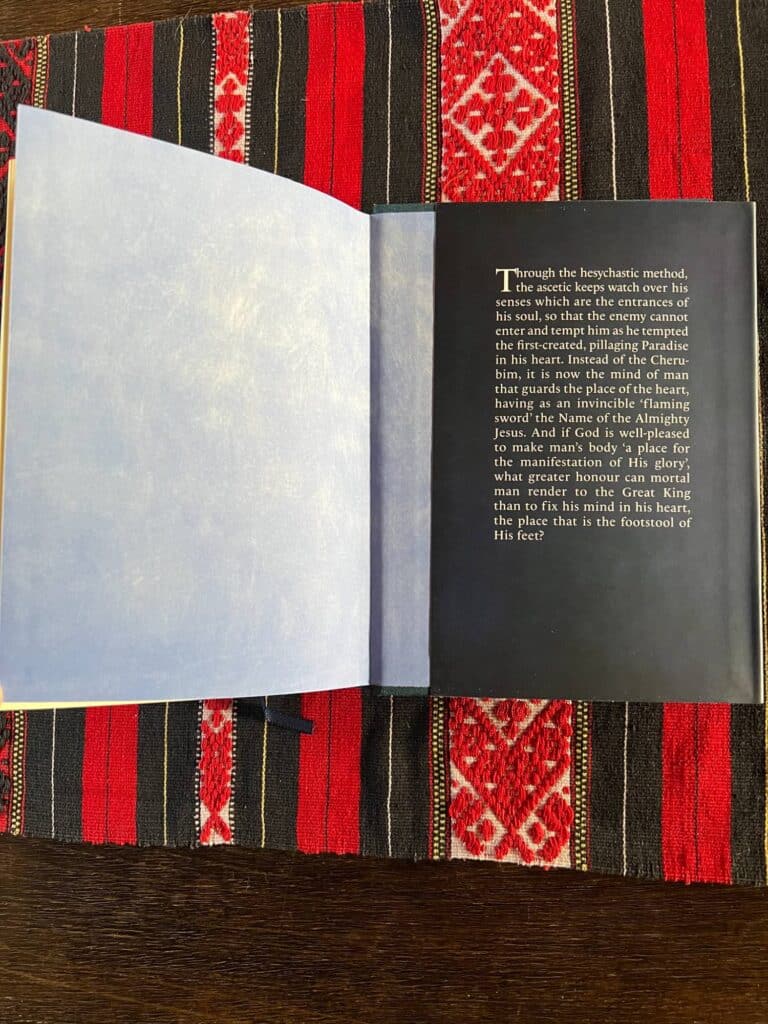 Open book with text about the ascetic method, "Through the hesychastic method...