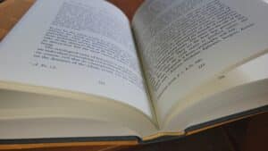 Open book with text on pages, showing "On the Purpose of Prayer" and page numbers 222 and 259.