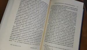 Open book showing text on pages discussing spiritual fatherhood and reconciliation.