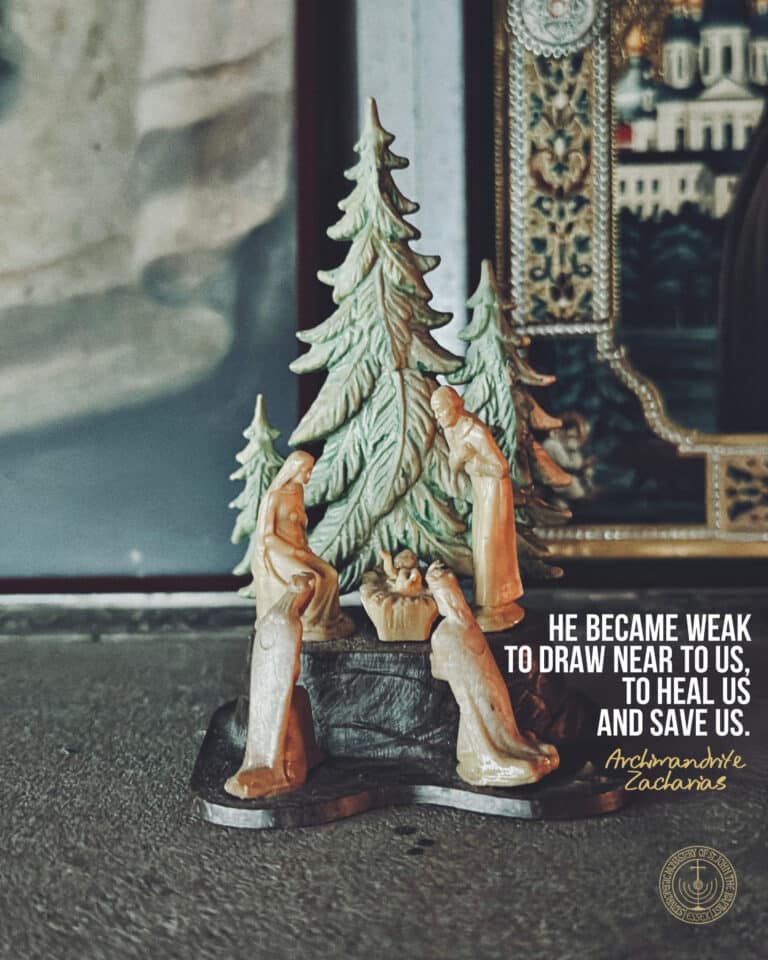 Nativity scene with quote: "He became weak to draw near to us, to heal us and save us." - Archimandrite Zacharias