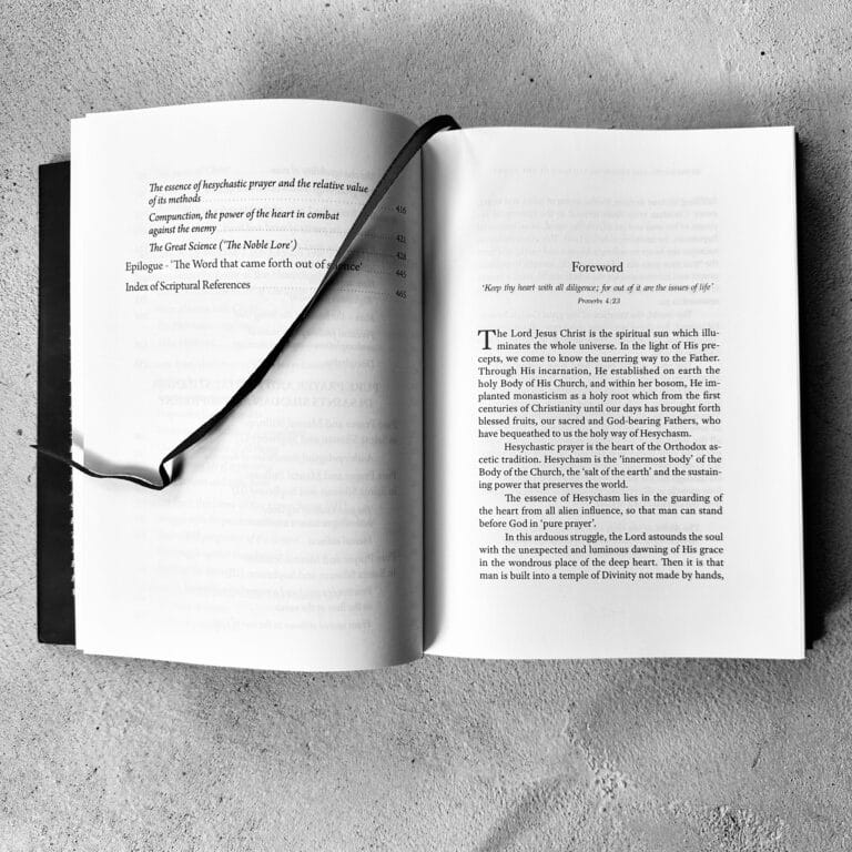 Open book with table of contents and foreword, featuring text on Hesychasm