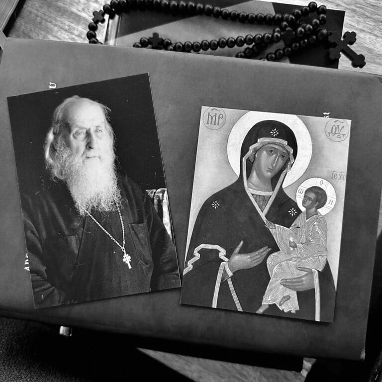 Orthodox icon of Mary and Jesus, with a portrait of an Orthodox priest and prayer beads.