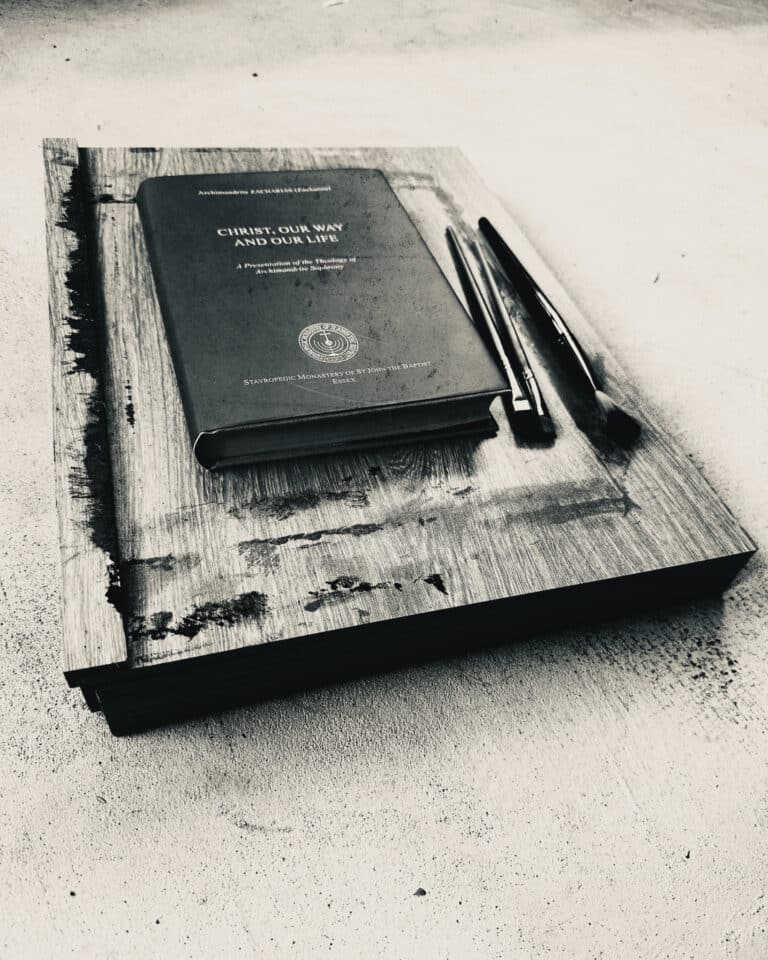 Black and white image of a book titled Christ, Our Way with brushes